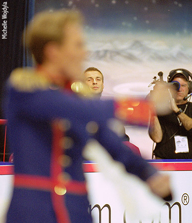 Coach Alexander Zhulin keeps an eye on Tatiana Navka &amp; Roman Kostomarov