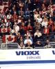 Shae-Lynn Bourne &amp; Victor Kraatz (CAN) skate past Canadian fans while waiting for their names to be called before the CD