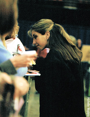 Naomi Lang signs autographs at the practice rink
