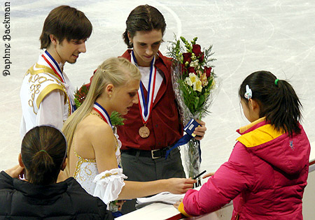 Piper, Tim, and Greg sign autographs