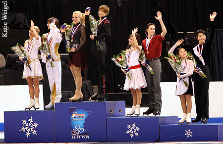 The medalists acknowledge the crowd