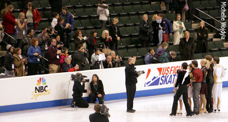 The photographers shoot the medalists off the podium