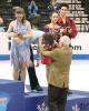 Una checks out her bronze medal while Andrew receives his
