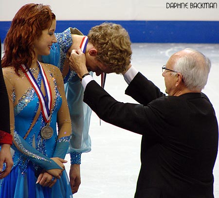 Evan Bates receives the final medal of the podium