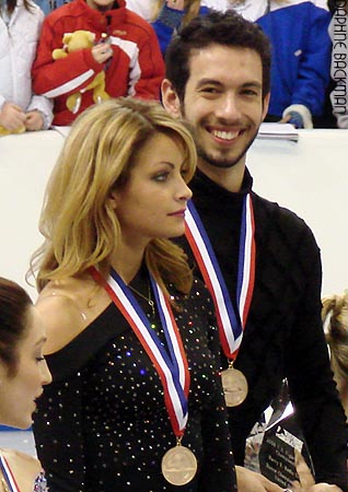 One gold medalist looks happier than the other