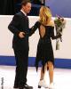 Tanith steadies Igor as he steps onto the ice in dress shoes