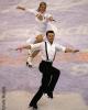 Mauri Gustafson &amp; Joel Dear skate across the logo at center ice