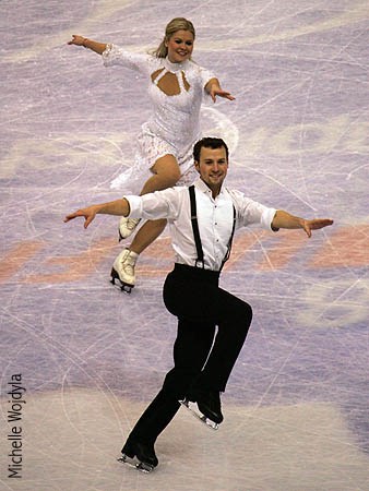 Mauri Gustafson &amp; Joel Dear skate across the logo at center ice