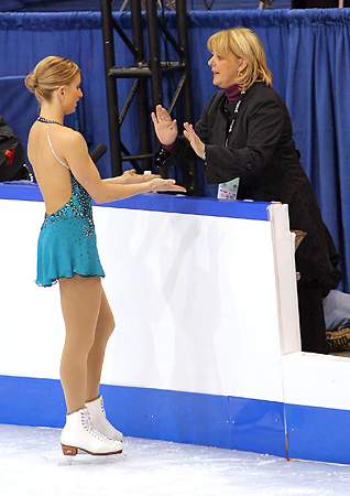 Rochette collects a high five before her free skate