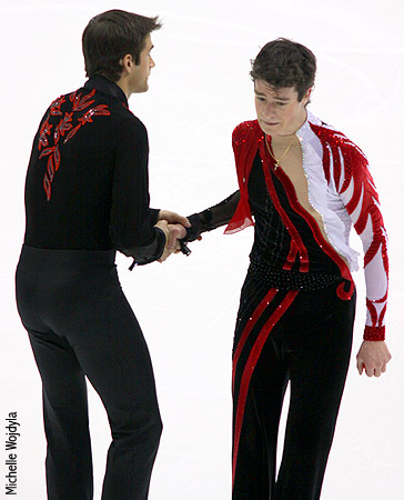 As Brandon Mroz leaves the ice after his free skate, fellow Broadmoor skater Ryan Bradley shakes his hand
