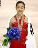 World Champion Yu-Na Kim draped in South Korea's flag