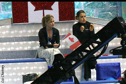 ...while Canadian ladies Joannie Rochette and Cynthia Phaneuf watch from their penthouse