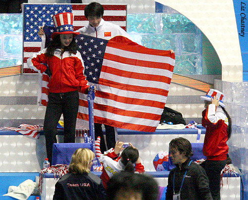 Bryce tries to slip past Team USA head cheerleader Lorrie Parker, while Team China works their fierce poses