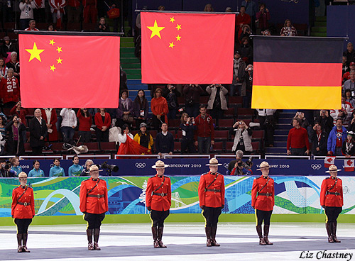 The flags of the medalists