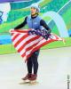 Apolo Anton Ohno with the American flag