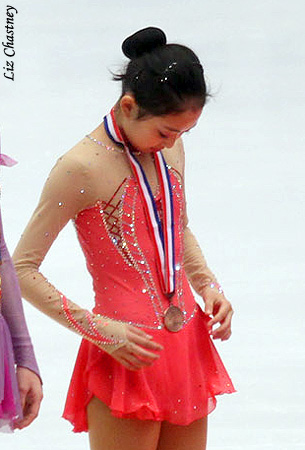 Junior Ladies: Zijun Li (CHN) checks out her medal