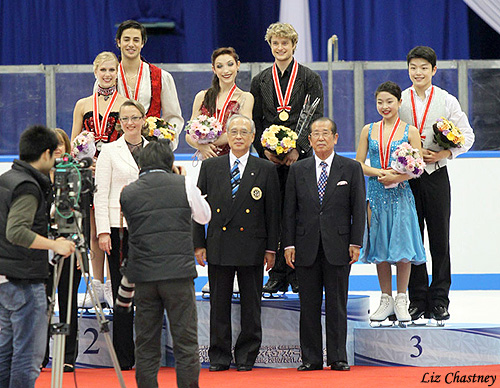 Event Officials Pose with Medalists