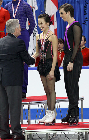 Madison Chock &amp; Greg Zuerlein (USA) receive their bronze medals from David Dore