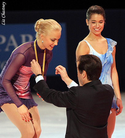 Kiira Korpi (FIN) receives her gold medal as Alissa Czisny (USA) looks on