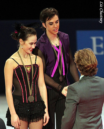 Madison Chock &amp; Greg Zuerlein (USA) receive congratulations from Gwendal Peizerat