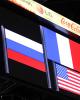 The flags of the medalists are shown on the jumbotron