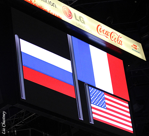 The flags of the medalists are shown on the jumbotron