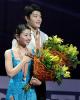 The bronze-medal-winning Shibutanis listen to their National Anthem.
