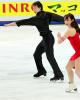 Cathy Reed &amp; Chris Reed (JPN) in front of the JINRO sponsor board signage