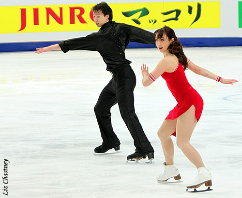 Cathy Reed &amp; Chris Reed (JPN) in front of the JINRO sponsor board signage