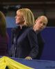 Kurt Browning peeks out behind Tracy Wilson during a break in the competition