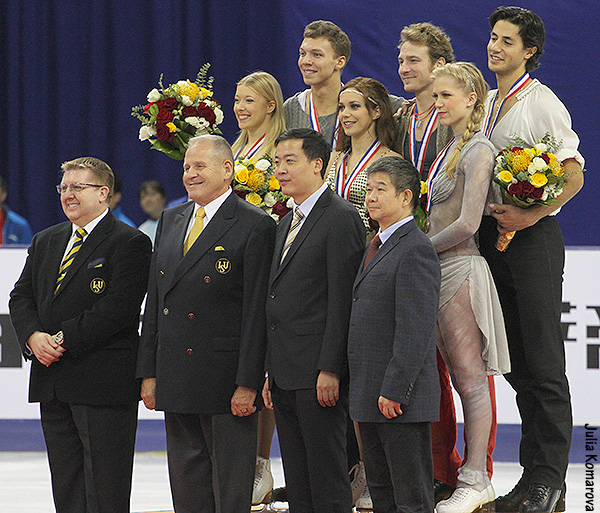The 2012 Cup of China medalists with the event officials