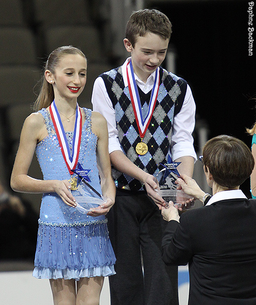 Chloe Lewis & Logan Bye receive their trophy from USFS president Pat St. Peter