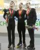 The men's medalists pose for fan photos