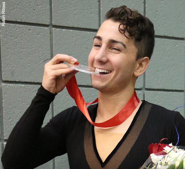 Max Aaron bites his "gold' medal