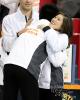 Nam Nguyen hugs Kristi Yamaguchi