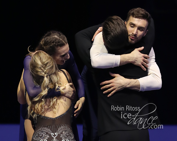 Hugs between Hubbell & Donohue and Papadakis & Cizeron